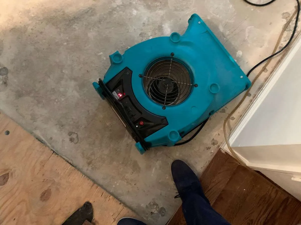 Air mover drying subfloor during Leak Detection & Repair in Worth